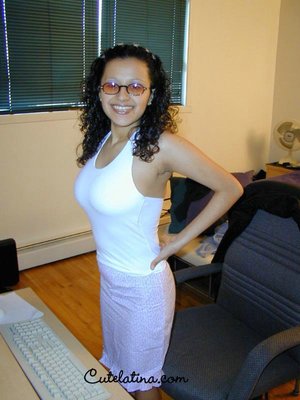 18 year old girl Katie Lewis stands naked after undressing in her bedroom